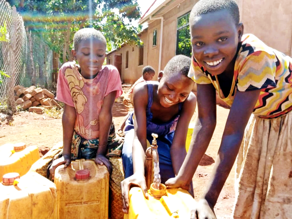 Tanzazian children fetching water